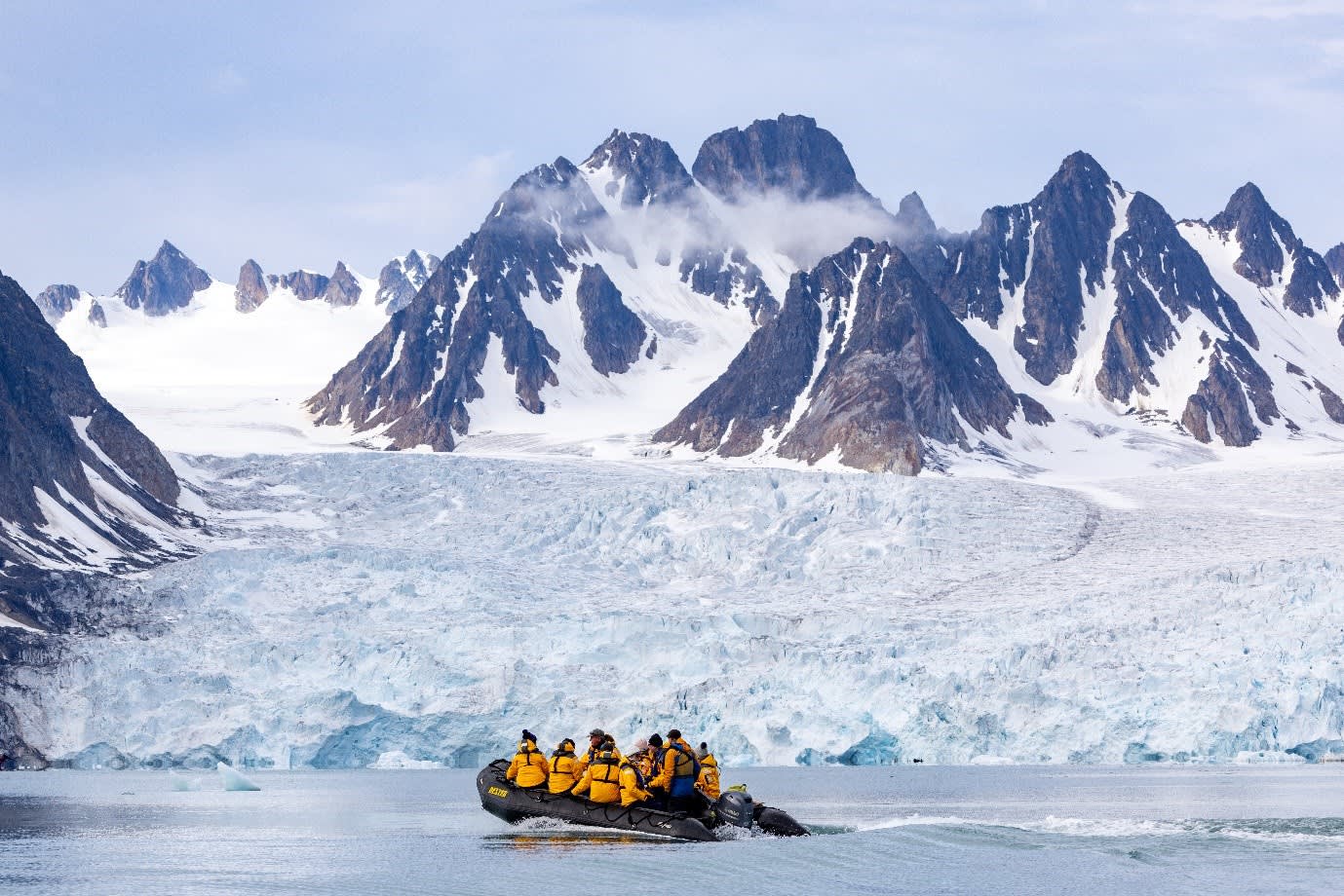 Travelers zodiac cruising near a glacier. Photo by Michelle Sole.